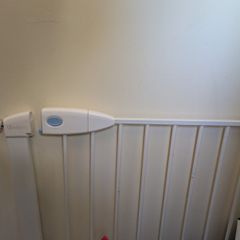 2 baby stair gates, one wooden and one standard