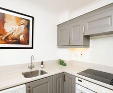 Kitchen with Quartz Countertop, Includes Some Appliances