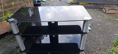 Black glass TV stand with silver legs