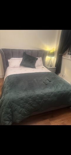 Reduced kingsize bed frame with matching curtains and leather armchair