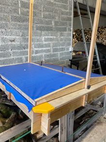 kids sandpit with roof