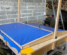 kids sandpit with roof