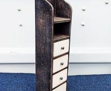 Vintage wooden storage unit with heavy ceramic drawers with brass knobs