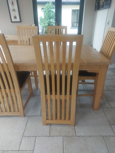 solid oak dining table and chairs