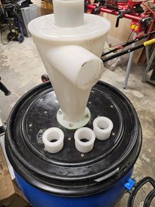 Woodworking barrel with dust commander cyclone and anti imploding valve