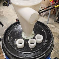 Woodworking barrel with dust commander cyclone and anti imploding valve
