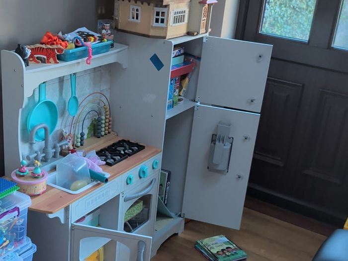 Large wooden play kitchen with fridge