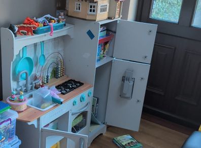 Large wooden play kitchen with fridge