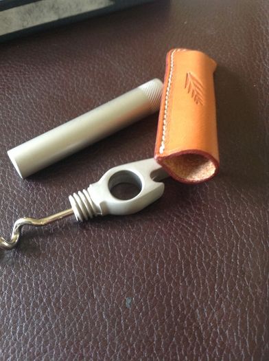 Corkscrew/ Bottle opener in Leather case.