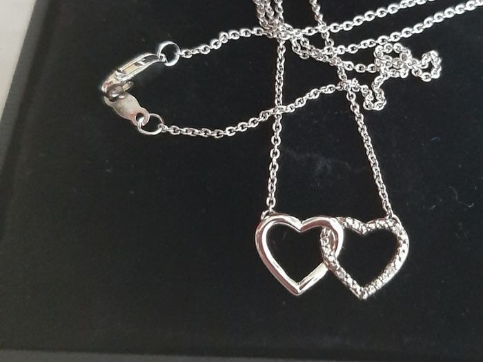 New silver pendant with real diamonds