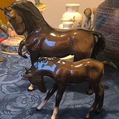 Capturing the elegance of the Arabian, this vintage figurine set includes a prancing Arabian horse