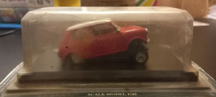 Vintage collectible cars in damaged boxes