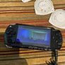 PSP  Console plus 10 games, charger and headphones Image 2