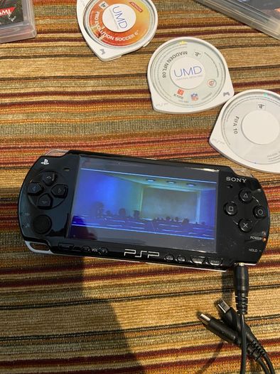 PSP  Console plus 10 games, charger and headphones