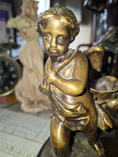 Antique French 19th century Bronze Sculpture Auguste Moreau featuring a Winged Putto Cherub Cupid carrying a shell or cornucopia like vessel, mounted on a marble base