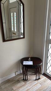 nest of tables and mirror