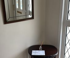 nest of tables and mirror