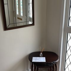 nest of tables and mirror