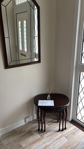 nest of tables and mirror