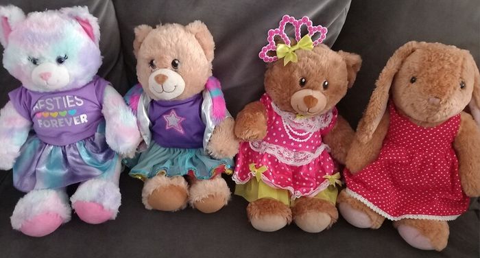 Build a Bear x 4 with outfits on.