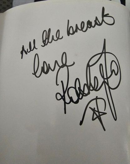 Robbie williams signed book and Jersey