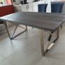 Grey dining table with chrome X legs Image 3
