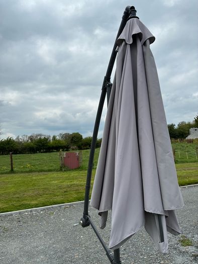 Large parasol and two weights. Bought for 170 last summer. Selling due to getting a pergola installed