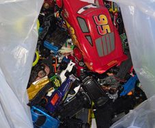 big bag of cars and a few wrestlers