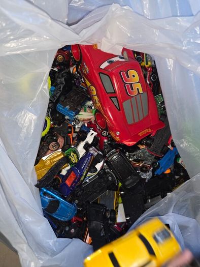 big bag of cars and a few wrestlers