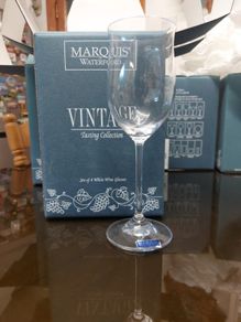 Two boxes of waterford white wine glasses