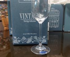 Two boxes of waterford white wine glasses