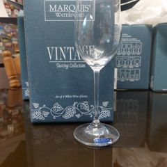 Two boxes of waterford white wine glasses