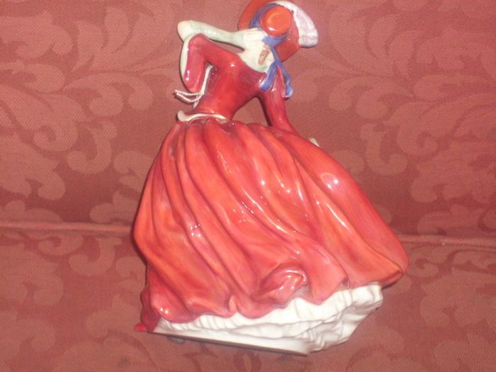a royal doulton figure of a girl