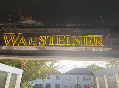 Man cave home bar neon warsteiner beer sign