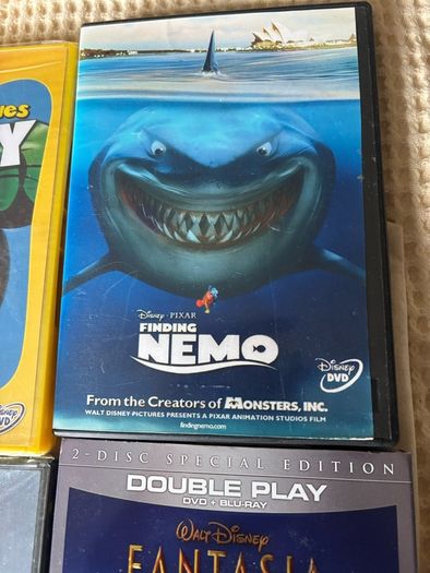 Four DVD's Fantasia (new) Goofy / March if the Penguins  & Nemo.