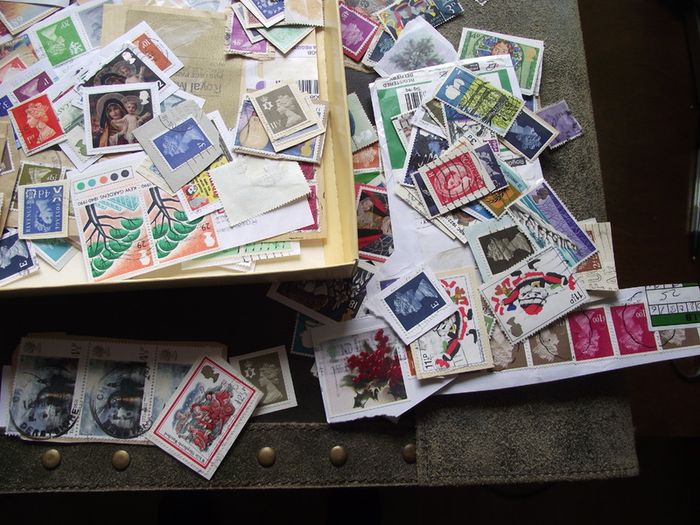 A box with collection of stamps from Great Britain