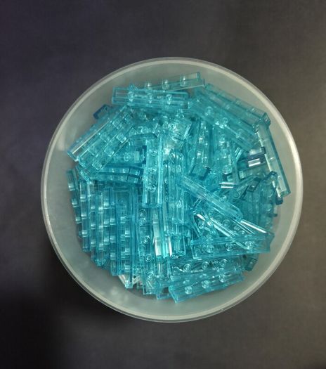 100x Lego Trans-Light Blue Tile 1 x 4