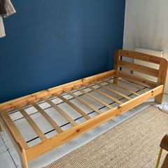 Single slatted wooden bed