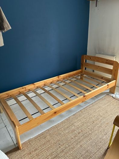 Single slatted wooden bed