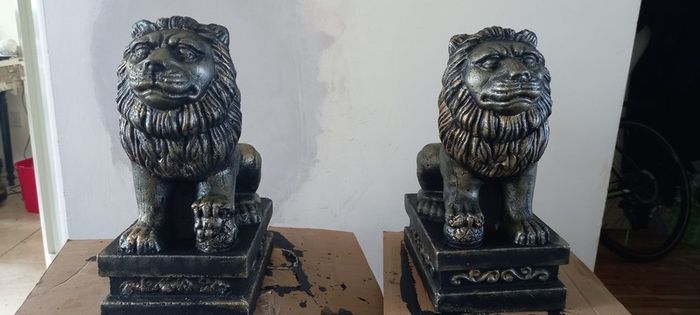 handcrafted concrete lions