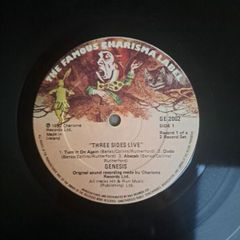 Genesis three sides live . Irish press on The famous Charisma label No sleeve . record 1 of a 2 record set