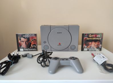 Playstation 1 console SCPH-7502 with games and cords