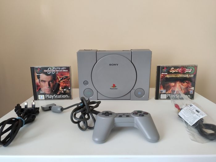 Playstation 1 console SCPH-7502 with games and cords