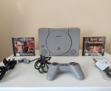 Playstation 1 console SCPH-7502 with games and cords