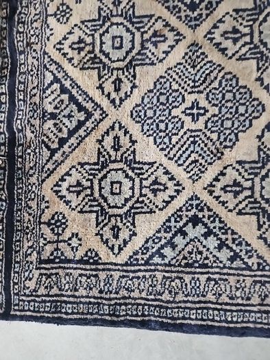 tiny wool rug...small mark on fringe.
