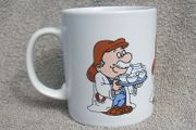 TETLEY TEA FOLK (Kilncraft STL) - a collectible mug showing three Tetley Tea Folk characters (early 1990s)