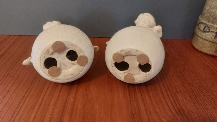 Lovely Vintage Pair of Ceramic Baby Winged Angels Sitting on Globes with a Very Tactile Cream Coloured Crackle Glaze