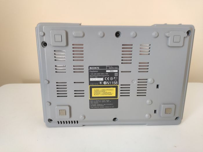 Playstation 1 console SCPH-7502 with games and cords