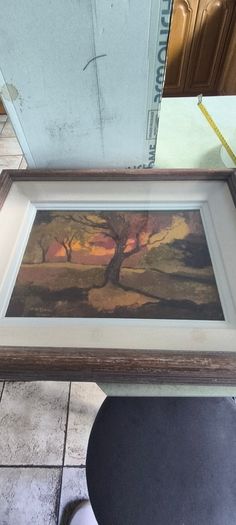 Framed under glass oil panting on board of land scape signed M.M KENNA