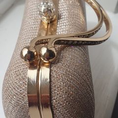 Ladies gold clutch bag